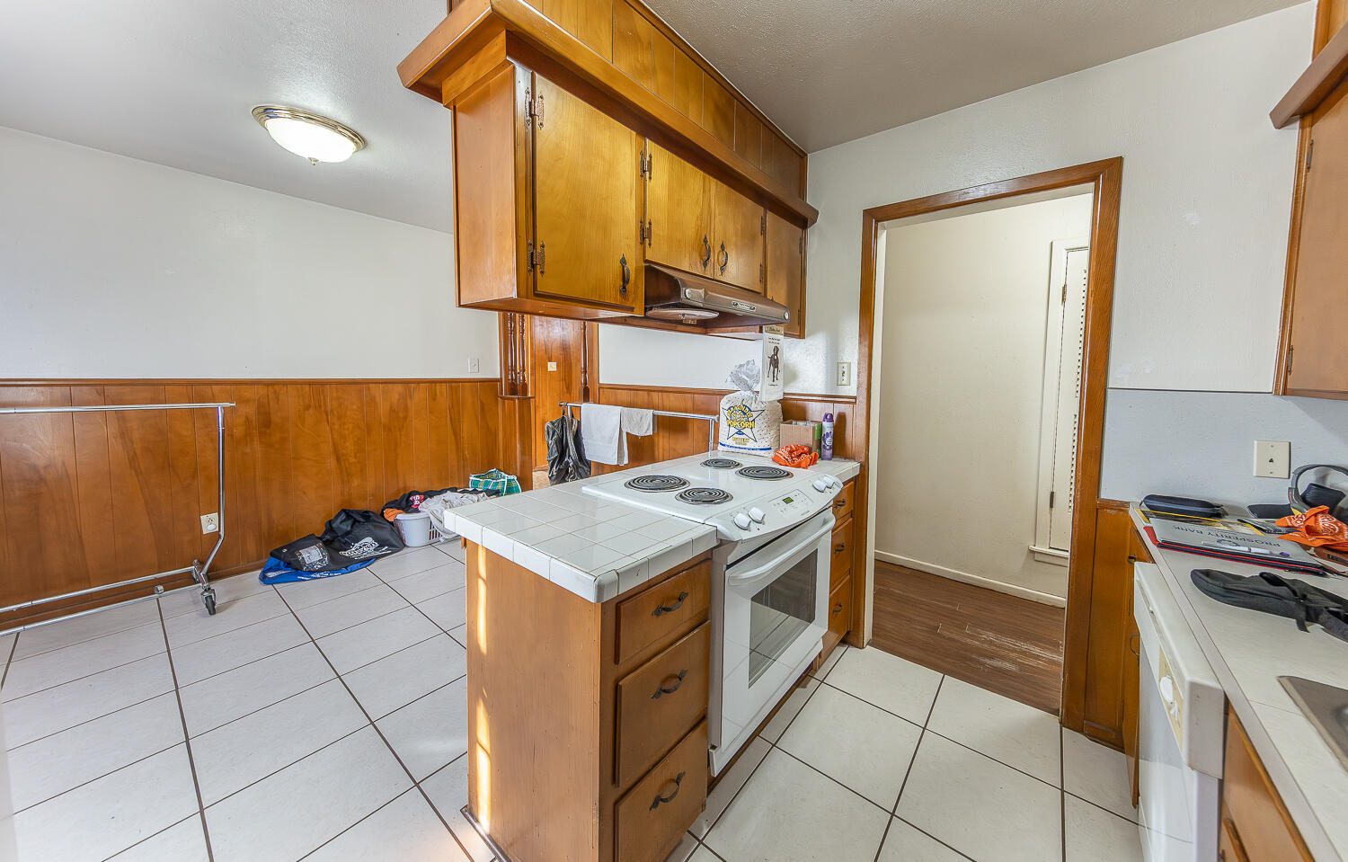 2410 33rd Street Lubbock, TX 79411 - Photo 5 of 14 a kitchen with a stove and a cabinets