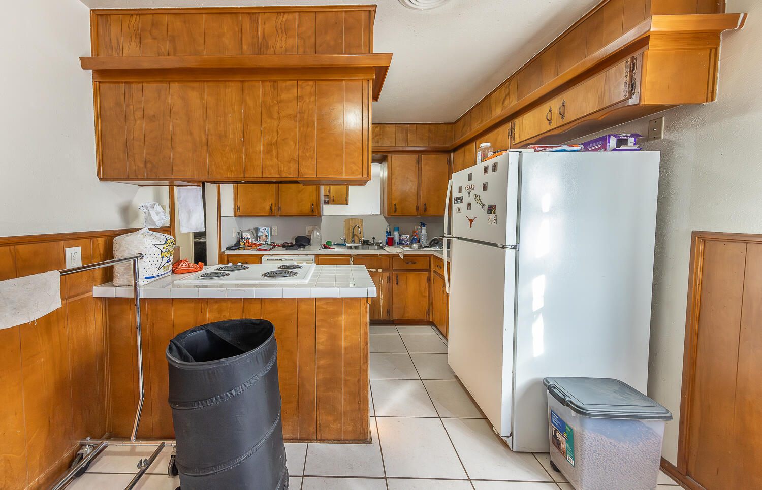 2410 33rd Street Lubbock, TX 79411 - Photo 6 of 14 a kitchen with a refrigerator and a sink