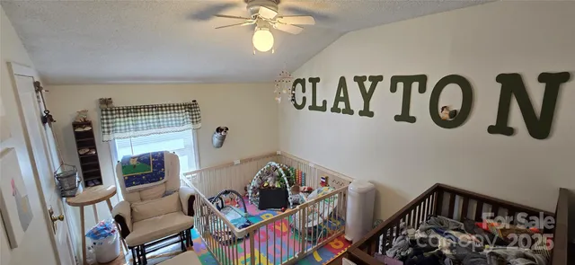a bedroom with furniture and a chandelier