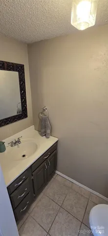 a room with a sink cabinets and utility