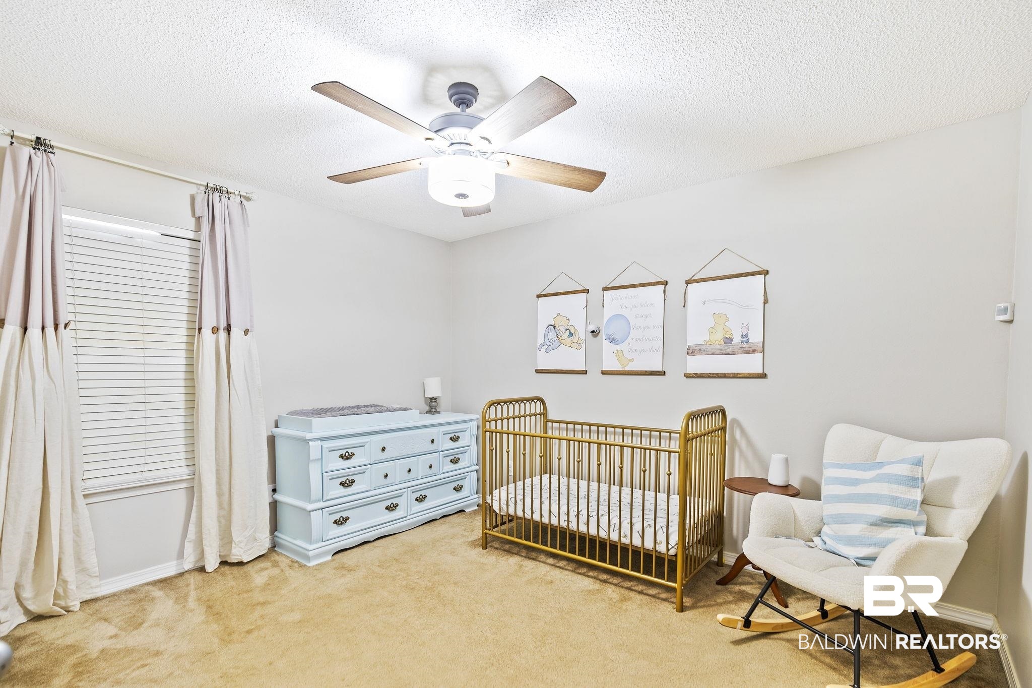 28246 Turkey Branch Drive Daphne, AL 36526 - Photo 22 of 41 Carpeted bedroom with ceiling fan, a textured ceiling, and a nursery area