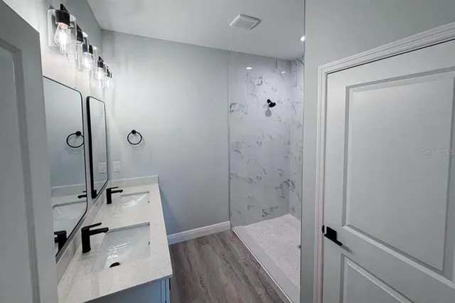 a bathroom with a sink and a shower