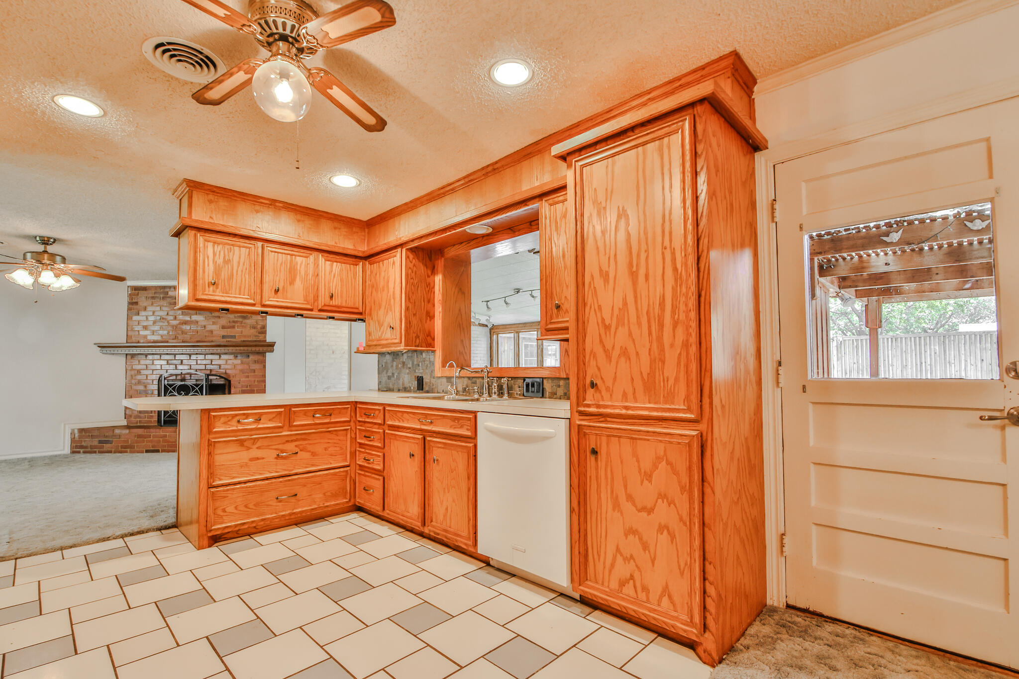 4315 47th Street Lubbock, TX 79413 - Photo 14 of 37 a kitchen with stainless steel appliances granite countertop a refrigerator and a sink