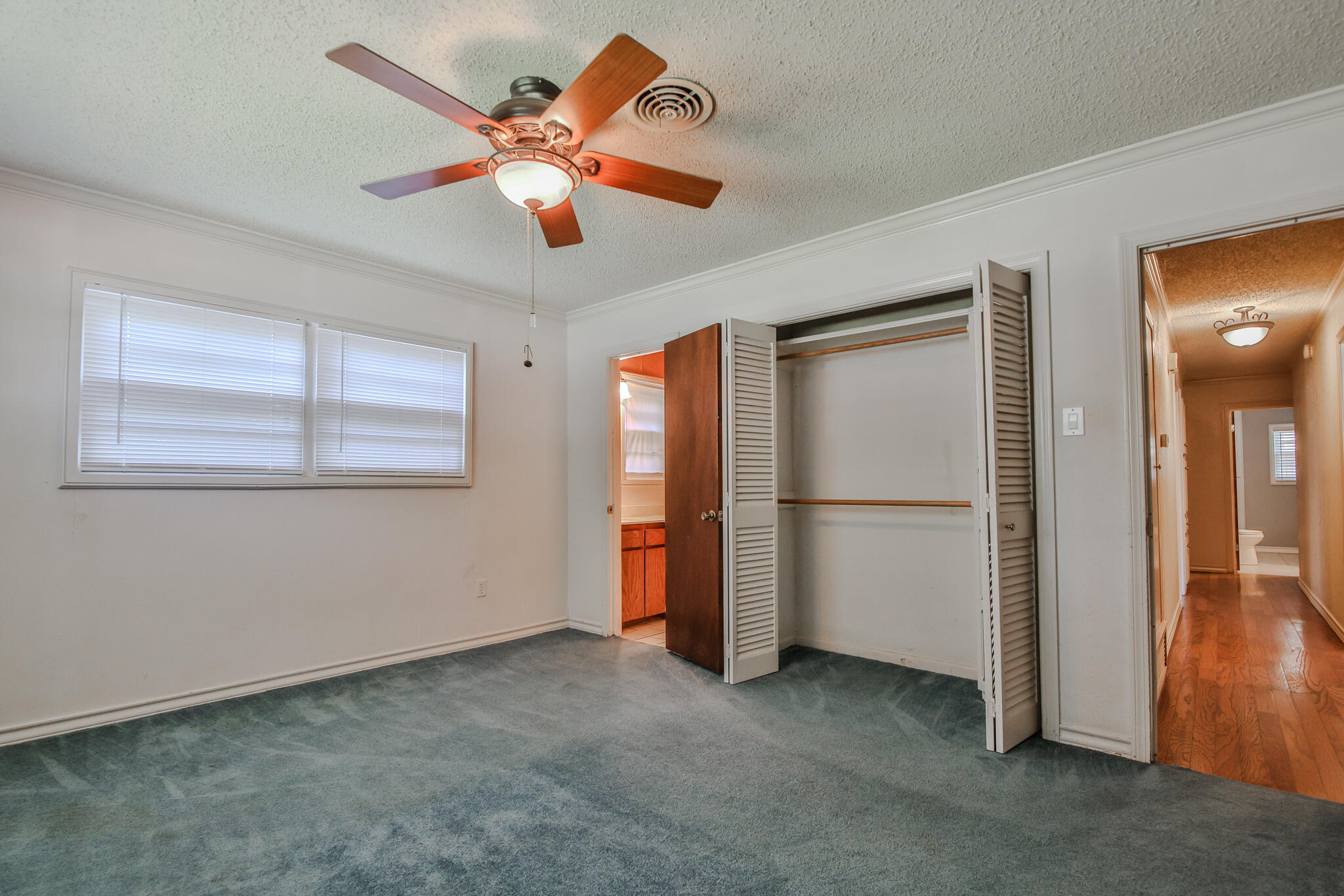 4315 47th Street Lubbock, TX 79413 - Photo 18 of 37 a view of an empty room with a ceiling fan