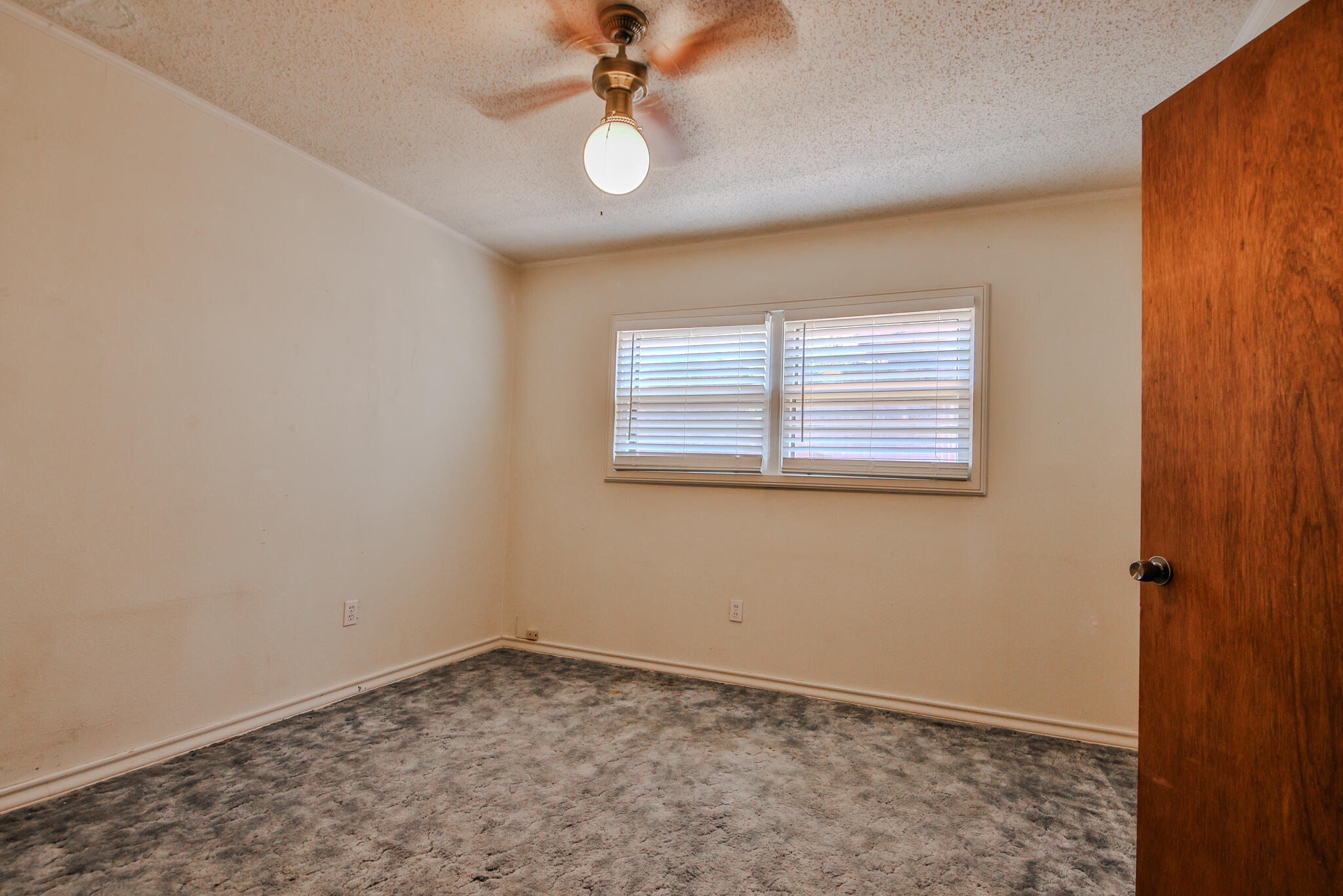4315 47th Street Lubbock, TX 79413 - Photo 22 of 37 an empty room with a window