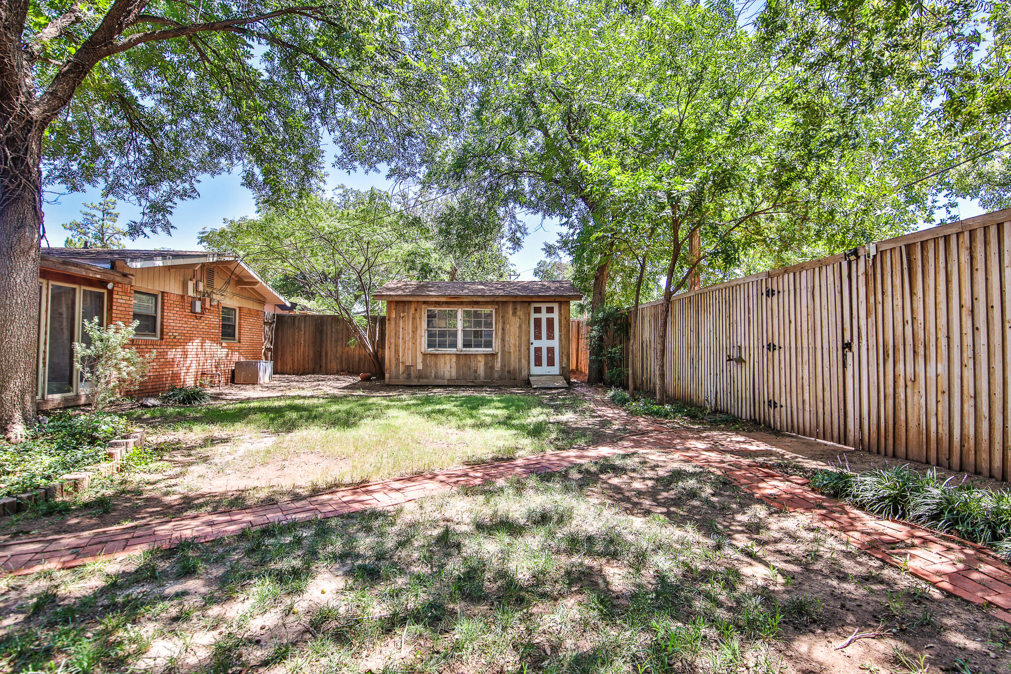 4315 47th Street Lubbock, TX 79413 - Photo 36 of 37 a backyard of a house with barbeque oven