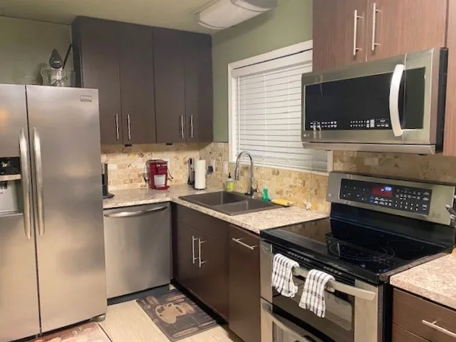 a kitchen with a stove and a microwave