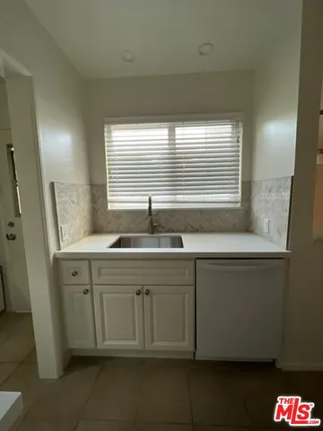 a bathroom with a sink and a window