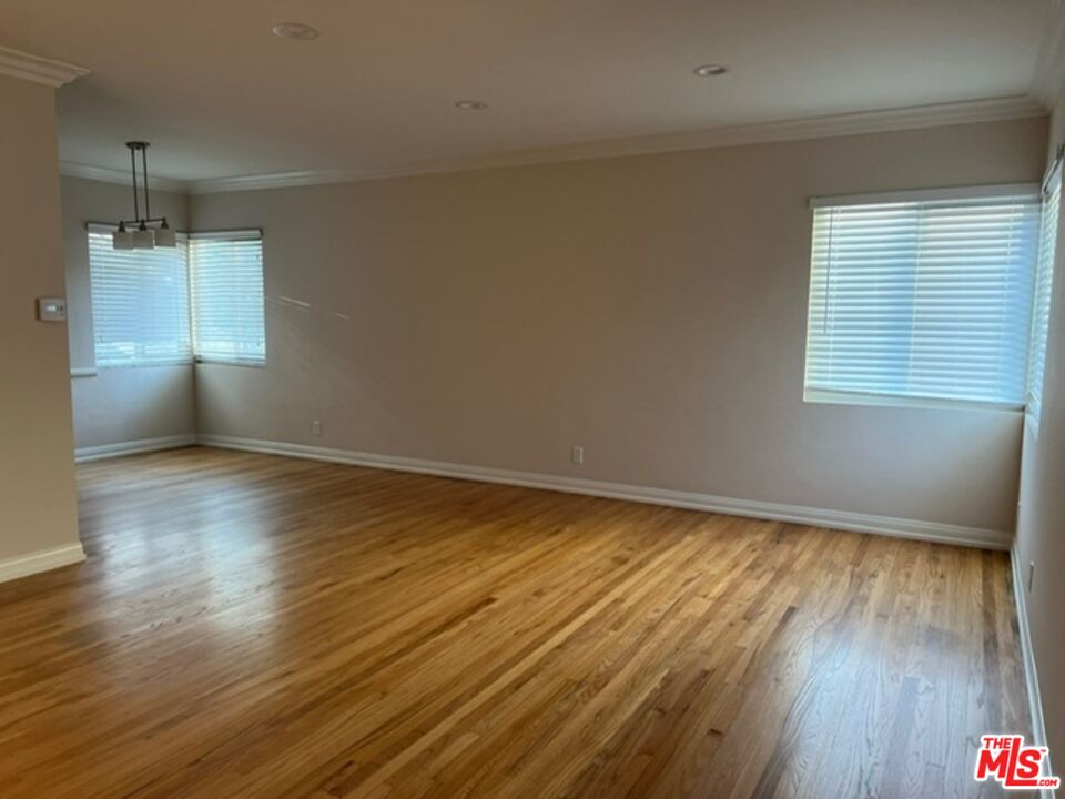 4164 Madison Avenue, Unit B Culver City, CA 90232 - Photo 2 of 21 an empty room with wooden floor and windows
