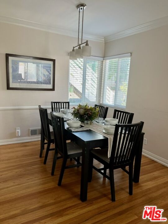 4164 Madison Avenue, Unit B Culver City, CA 90232 - Photo 21 of 21 a view of a dining room with furniture window and wooden floor
