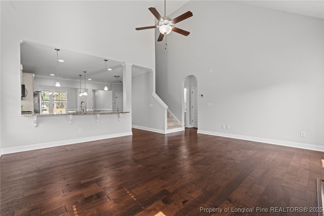 335 Parrish Lane Carthage, NC 28327 - Photo 20 of 50 a view of an empty room with wooden floor and a ceiling fan
