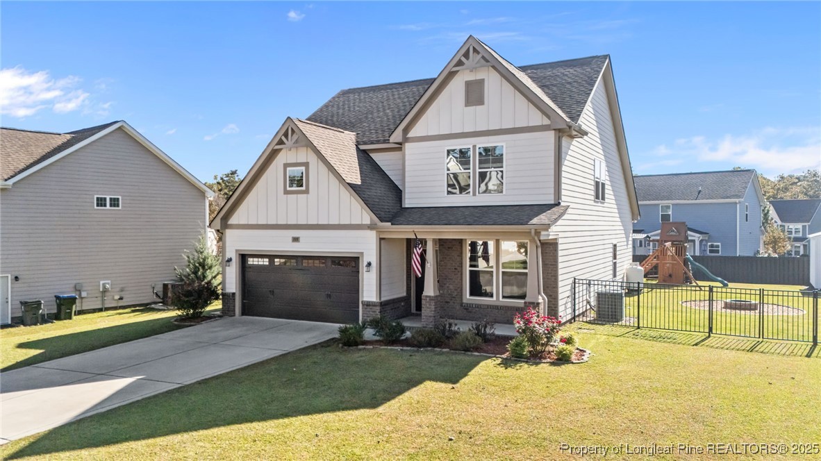 335 Parrish Lane Carthage, NC 28327 - Photo 2 of 50 a front view of a house with garden
