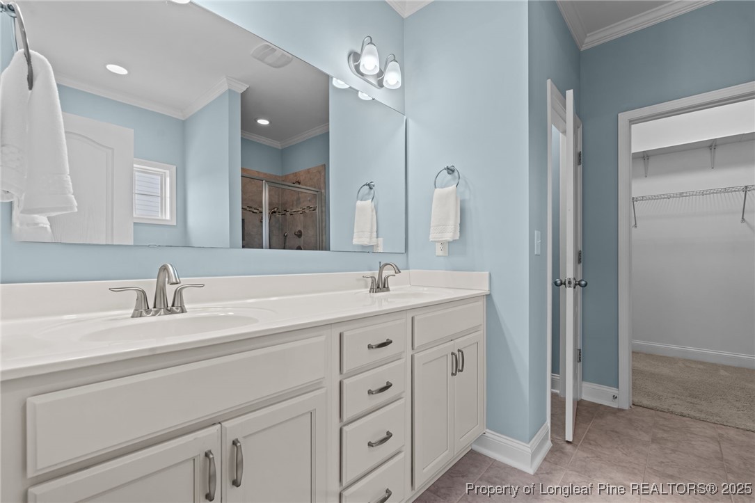 335 Parrish Lane Carthage, NC 28327 - Photo 25 of 50 a spacious bathroom with double sink a a mirror a vanity and a shower