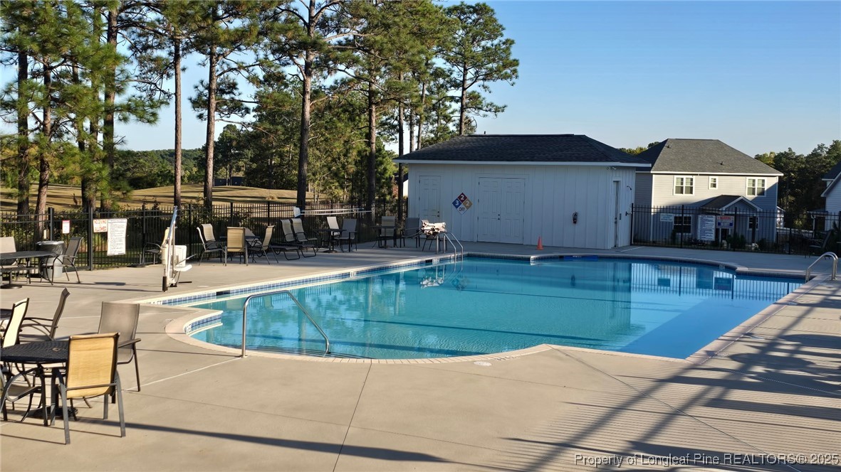 335 Parrish Lane Carthage, NC 28327 - Photo 50 of 50 a view of a house with swimming pool and sitting area