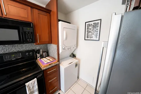 a bathroom with a granite countertop sink toilet a mirror a vanity and shower