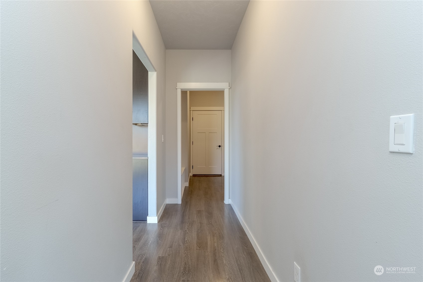 862 Boulder Street Walla Walla, WA 99362 - Photo 11 of 38 a view of a hallway with wooden floor
