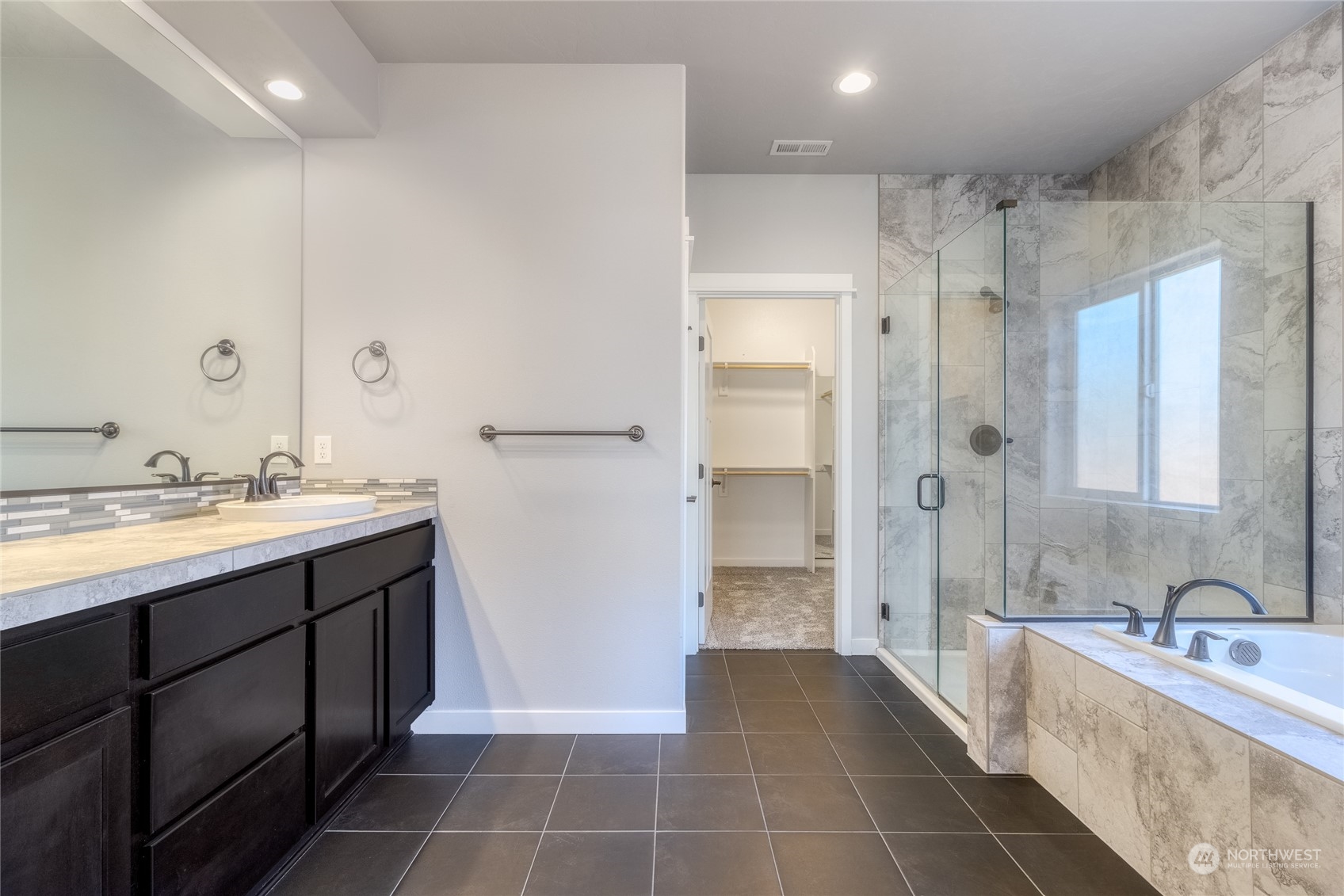 862 Boulder Street Walla Walla, WA 99362 - Photo 14 of 38 a spacious bathroom with a mirror a shower and a sink
