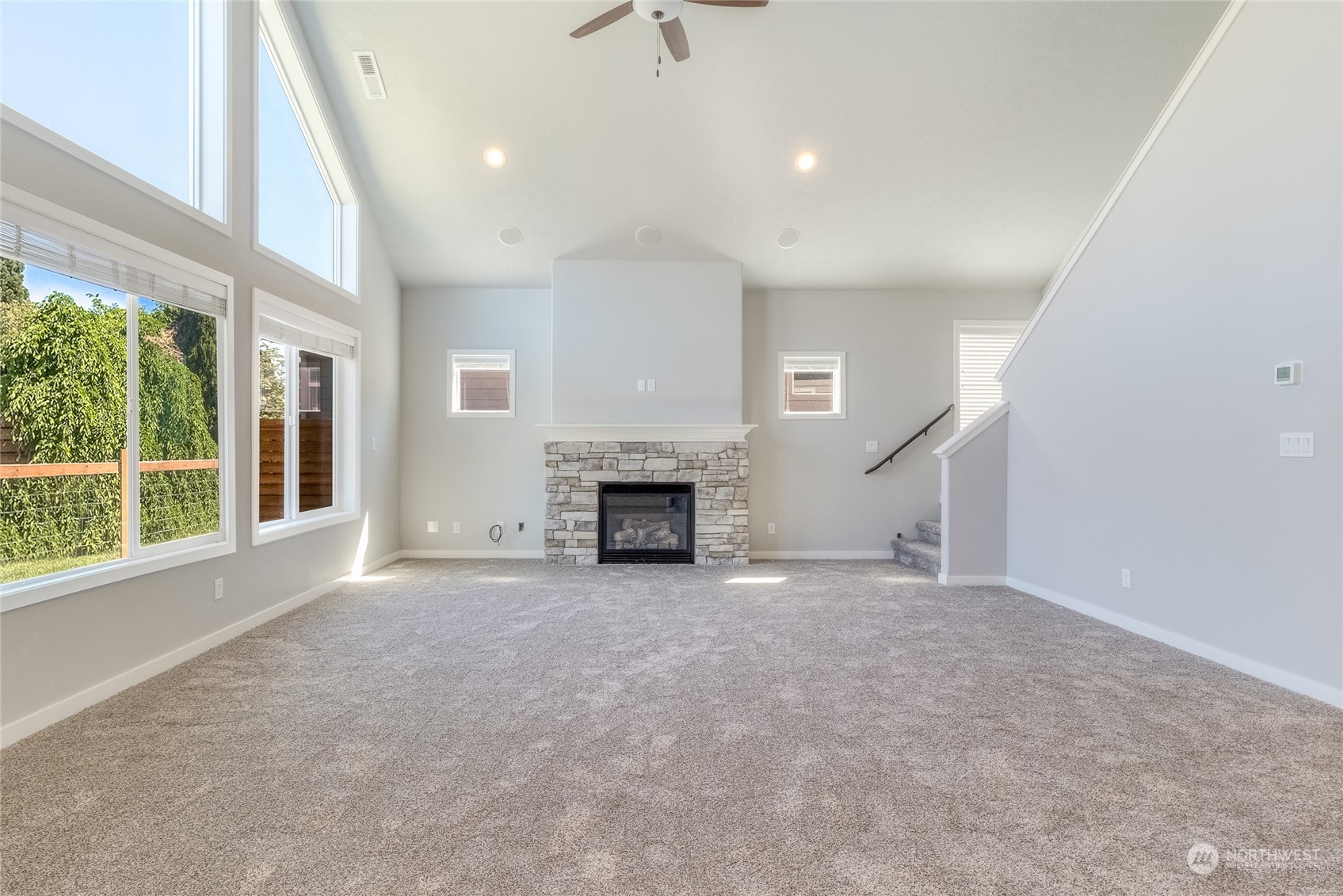 862 Boulder Street Walla Walla, WA 99362 - Photo 4 of 38 a view of an empty room with a fireplace and a window