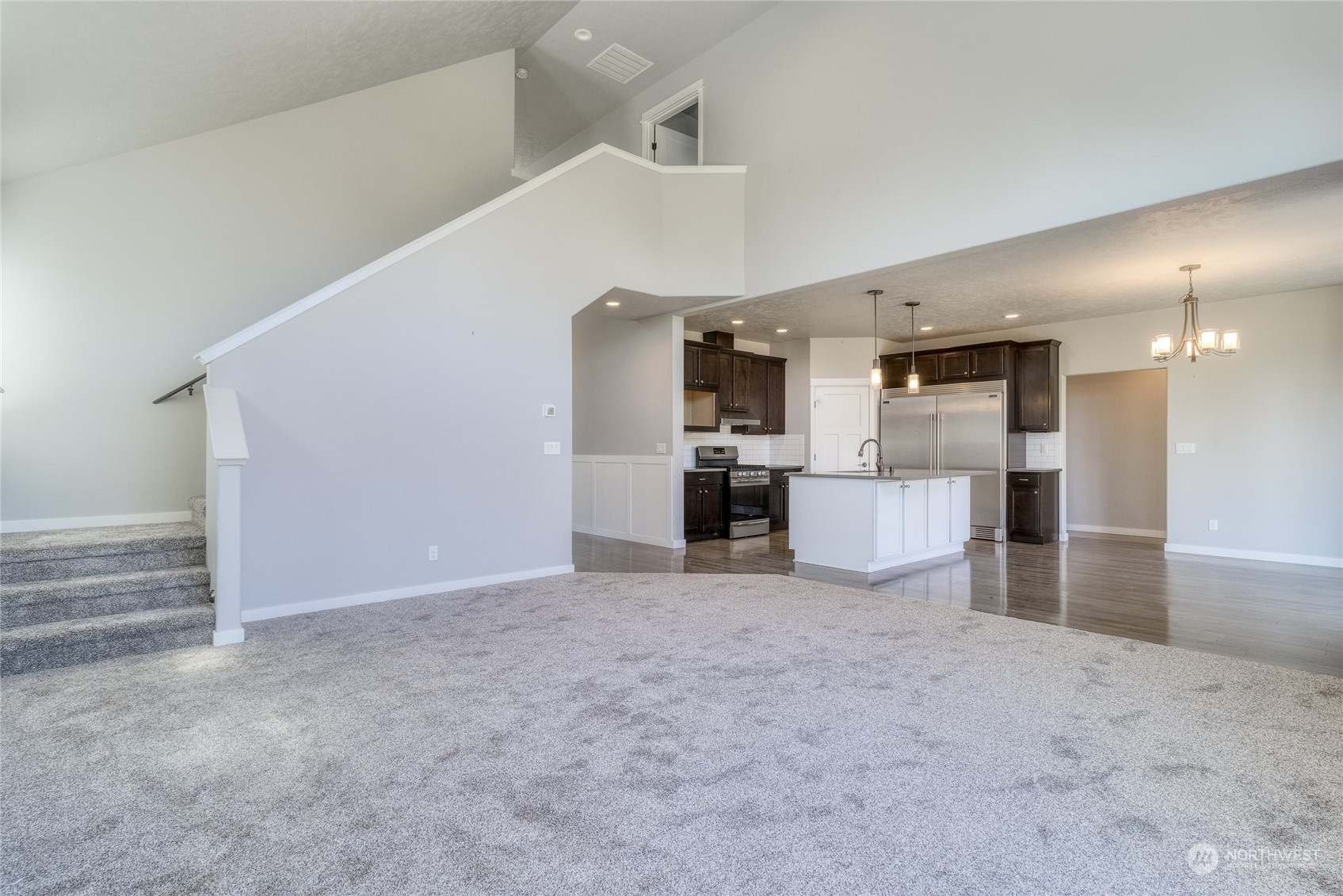 862 Boulder Street Walla Walla, WA 99362 - Photo 6 of 38 a view of a kitchen with a sink and dishwasher a refrigerator oven a kitchen island