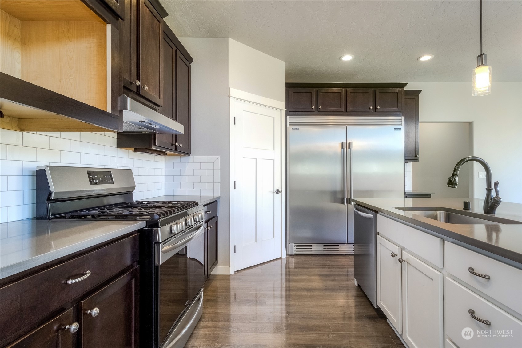 862 Boulder Street Walla Walla, WA 99362 - Photo 7 of 38 a kitchen with stainless steel appliances granite countertop a sink stove and refrigerator
