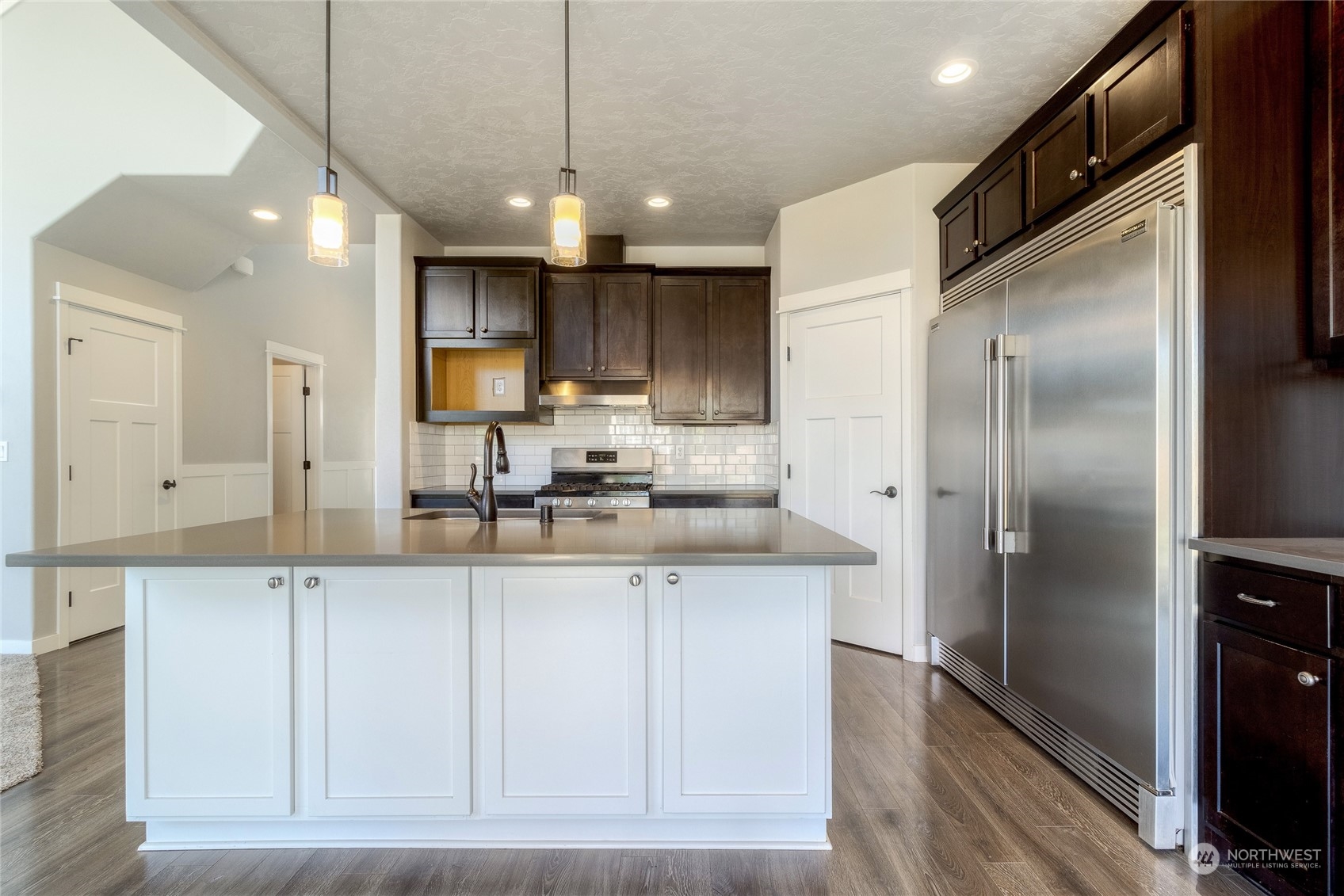 862 Boulder Street Walla Walla, WA 99362 - Photo 8 of 38 a kitchen with stainless steel appliances granite countertop a refrigerator a sink and a stove