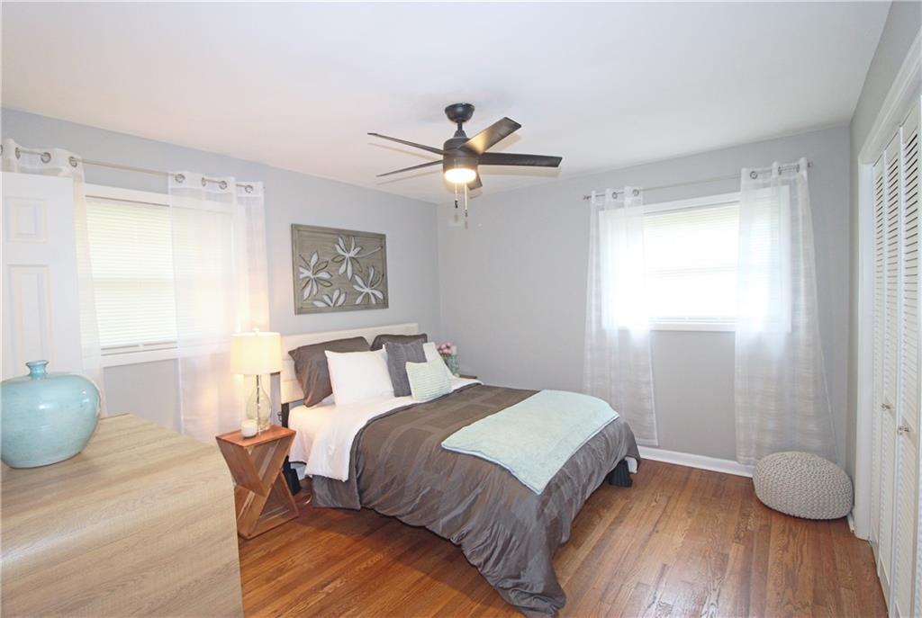2450 Elkhorn Drive Decatur, GA 30034 - Photo 11 of 32 a bedroom with a bed and a lamp with window