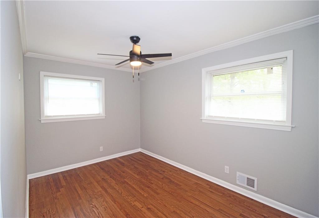 2450 Elkhorn Drive Decatur, GA 30034 - Photo 16 of 32 a view of an empty room with wooden floor and a window