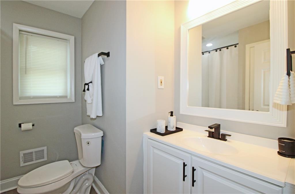 2450 Elkhorn Drive Decatur, GA 30034 - Photo 18 of 32 a bathroom with a sink vanity granite and toilet