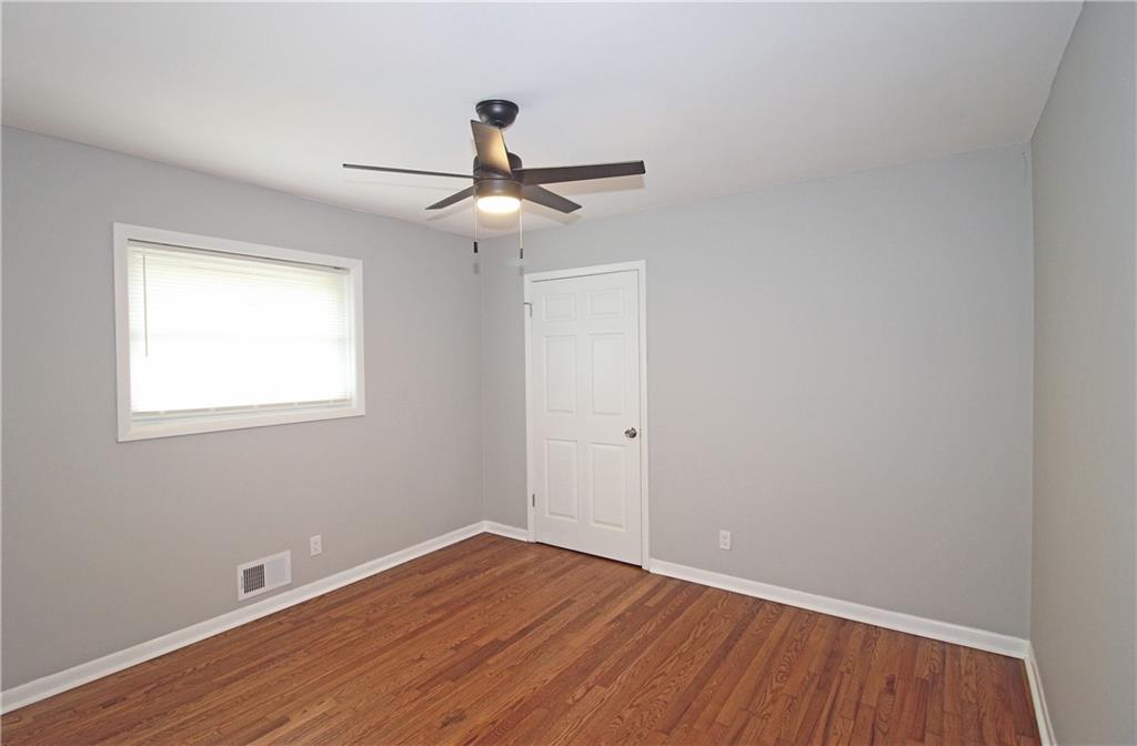 2450 Elkhorn Drive Decatur, GA 30034 - Photo 20 of 32 wooden floor in an empty room with a window