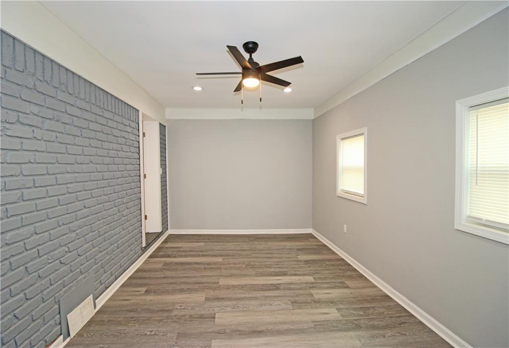 2450 Elkhorn Drive Decatur, GA 30034 - Photo 23 of 32 a view of empty room with wooden floor and fan
