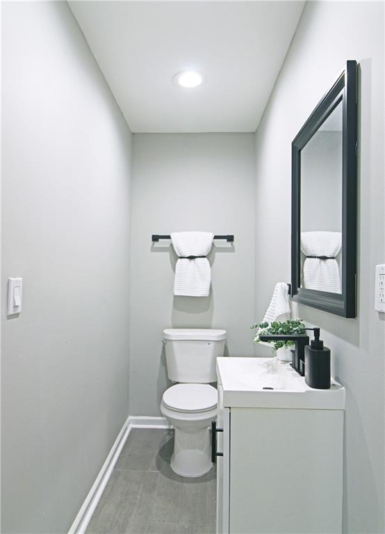 2450 Elkhorn Drive Decatur, GA 30034 - Photo 24 of 32 a bathroom with a toilet sink and mirror