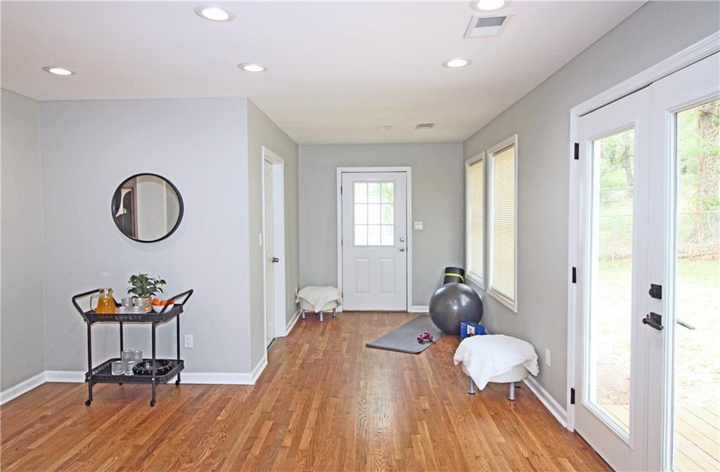 2450 Elkhorn Drive Decatur, GA 30034 - Photo 26 of 32 a living room with furniture a window entryway and wooden floor