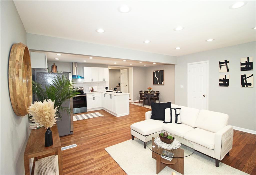 2450 Elkhorn Drive Decatur, GA 30034 - Photo 6 of 32 a living room with furniture a dining table and kitchen view