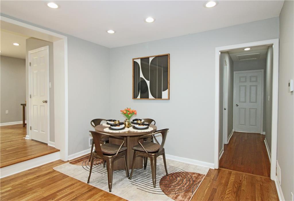 2450 Elkhorn Drive Decatur, GA 30034 - Photo 7 of 32 a view of a dining room with furniture and wooden floor