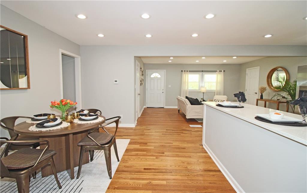 2450 Elkhorn Drive Decatur, GA 30034 - Photo 10 of 32 a very nice looking dining room with kitchen island a stove a table and chairs