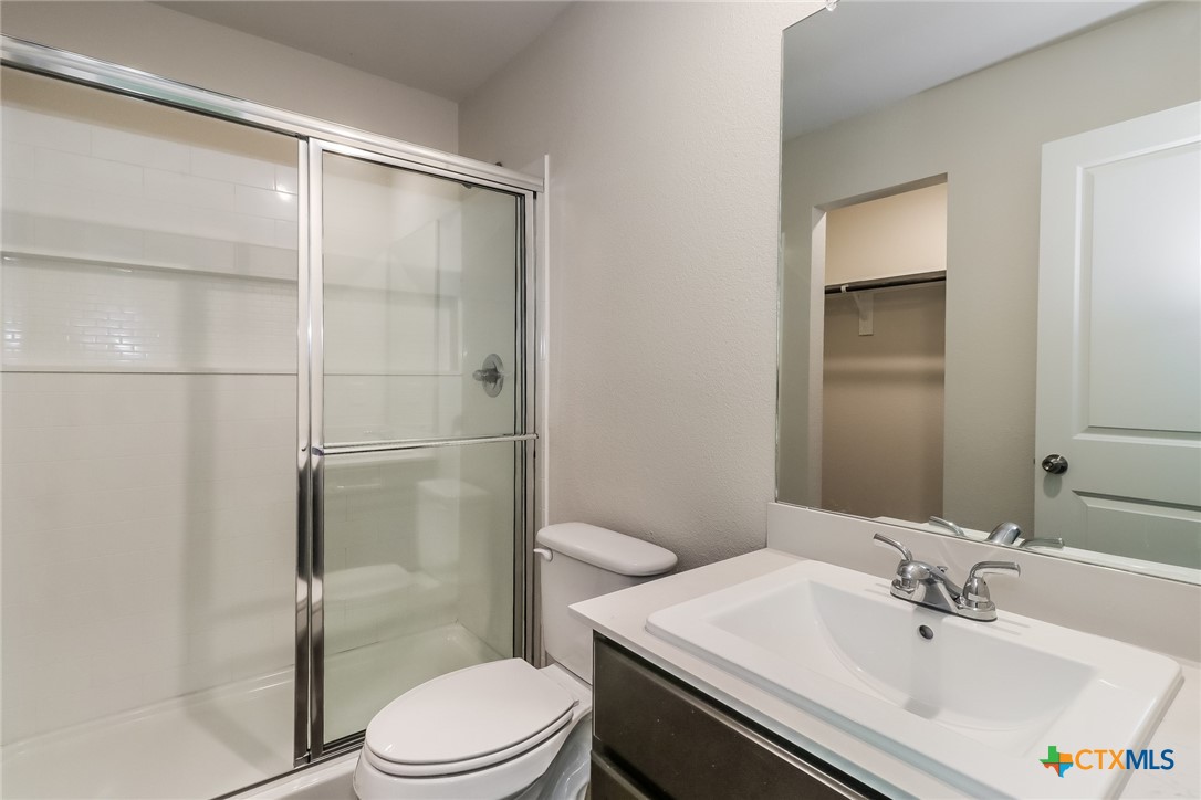 1005 South 22nd Street Temple, TX 76501 - Photo 11 of 21 a bathroom with a sink toilet and shower