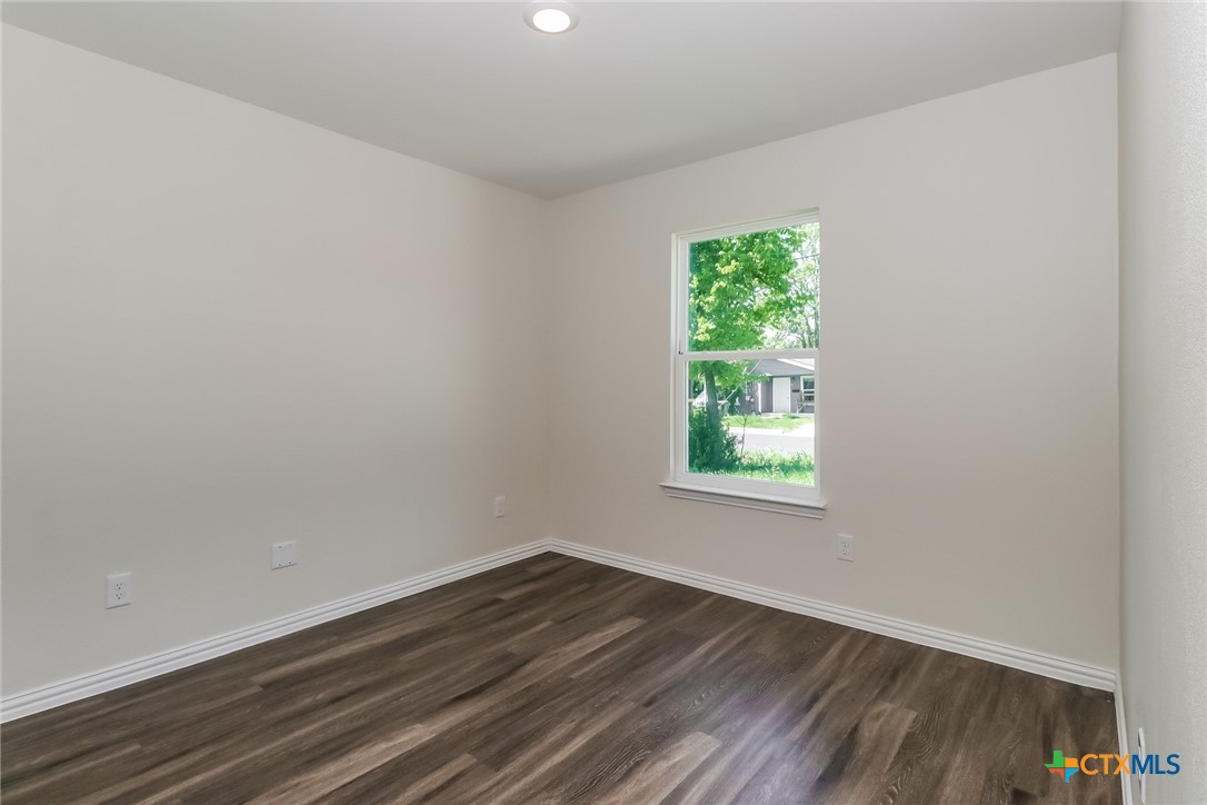 1005 South 22nd Street Temple, TX 76501 - Photo 13 of 21 a view of a room that has wooden floor and window