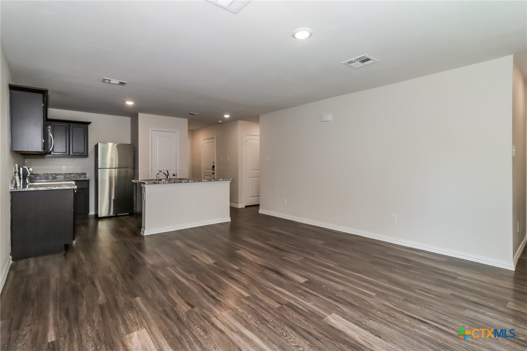 1005 South 22nd Street Temple, TX 76501 - Photo 5 of 21 a view of kitchen with wooden floor