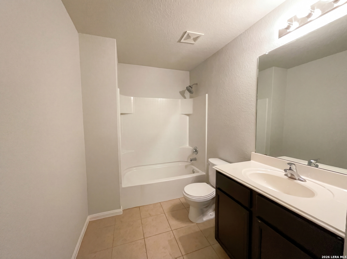 12325 Switchgrass San Antonio, TX 78252 - Photo 13 of 18 a bathroom with a sink a toilet and shower
