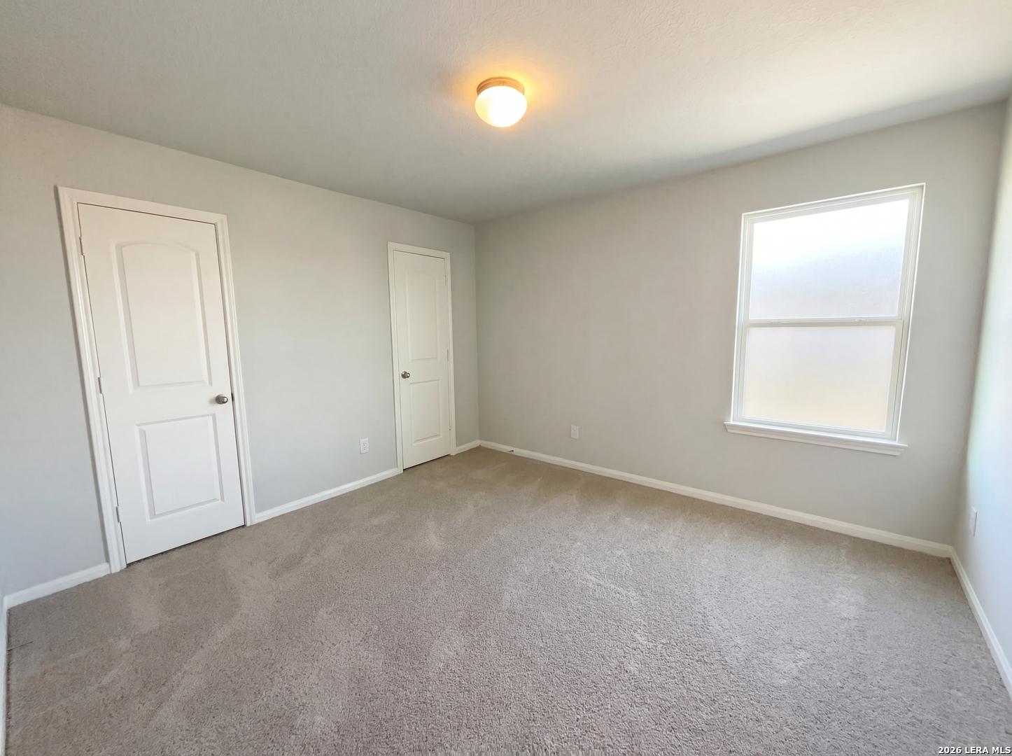 12325 Switchgrass San Antonio, TX 78252 - Photo 6 of 18 an empty room with windows and closet