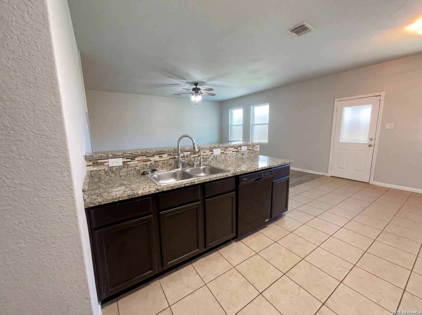12325 Switchgrass San Antonio, TX 78252 - Photo 9 of 18 a bathroom with a granite countertop sink and a mirror