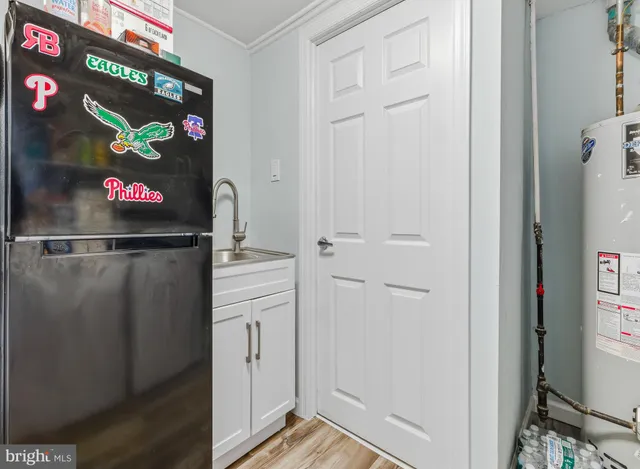 a view of a white house with a yard