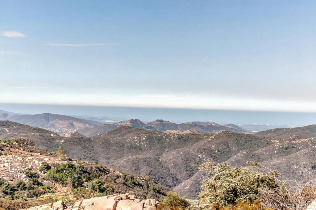 an aerial view of mountains in the background