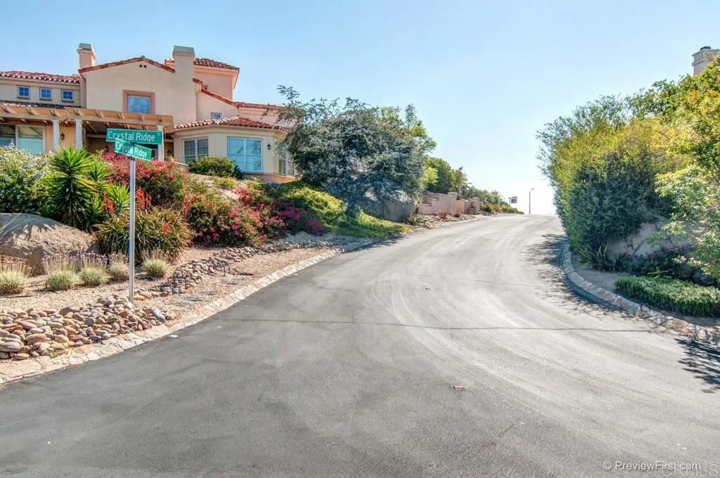 Crystal Ridge Escondido, CA 92026 - Photo 17 of 21 a front view of a house with a yard and garage