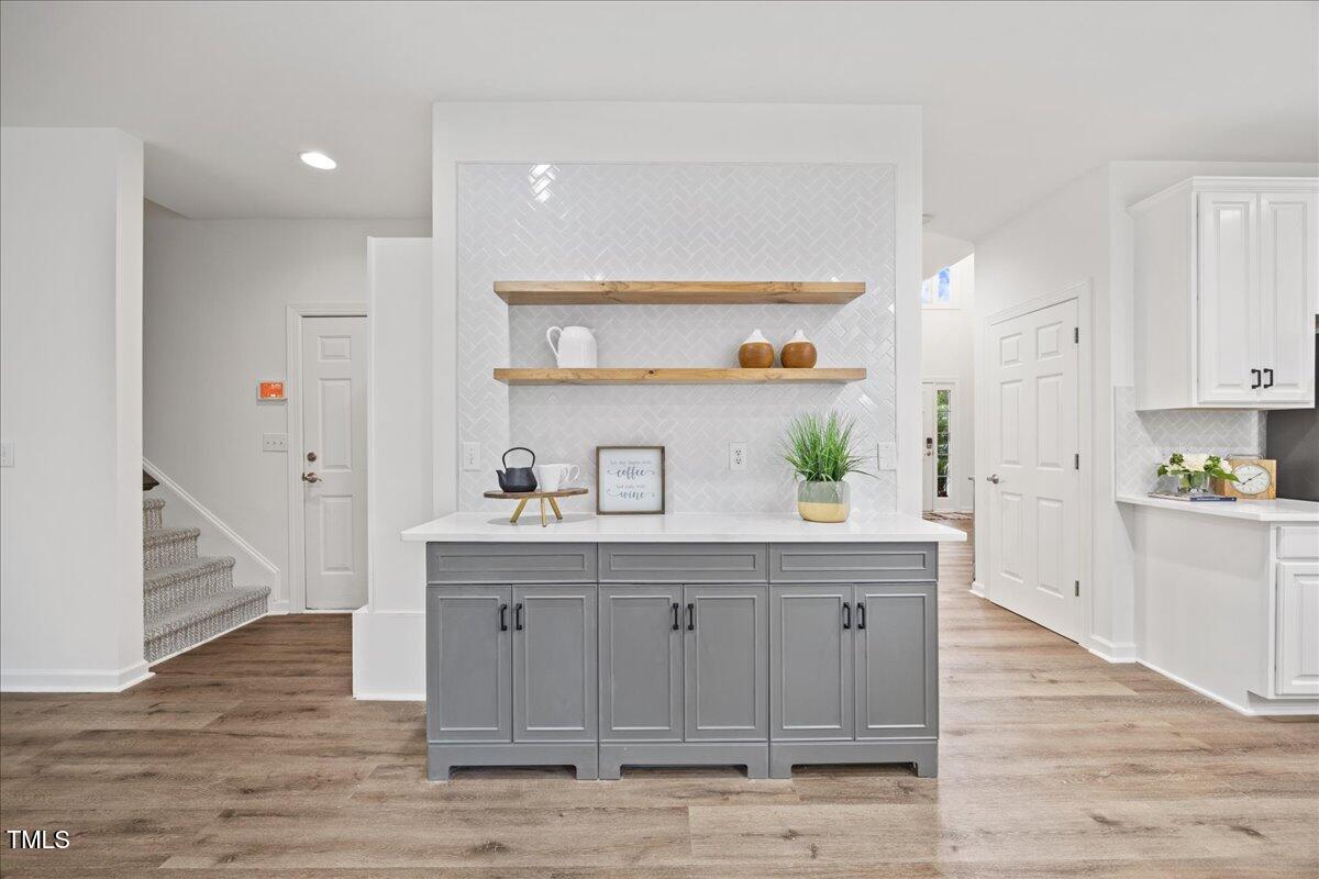 4 Pickard Place Durham, NC 27703 - Photo 14 of 80 a kitchen with stainless steel appliances granite countertop a sink a stove and a wooden floors