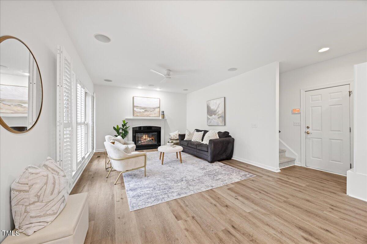 4 Pickard Place Durham, NC 27703 - Photo 16 of 80 a living room with furniture a mirror and a fireplace
