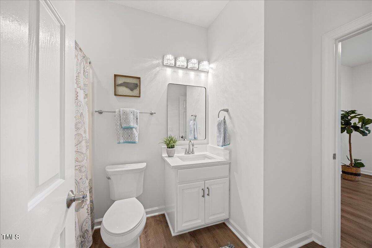 4 Pickard Place Durham, NC 27703 - Photo 21 of 80 a bathroom with a toilet sink and mirror