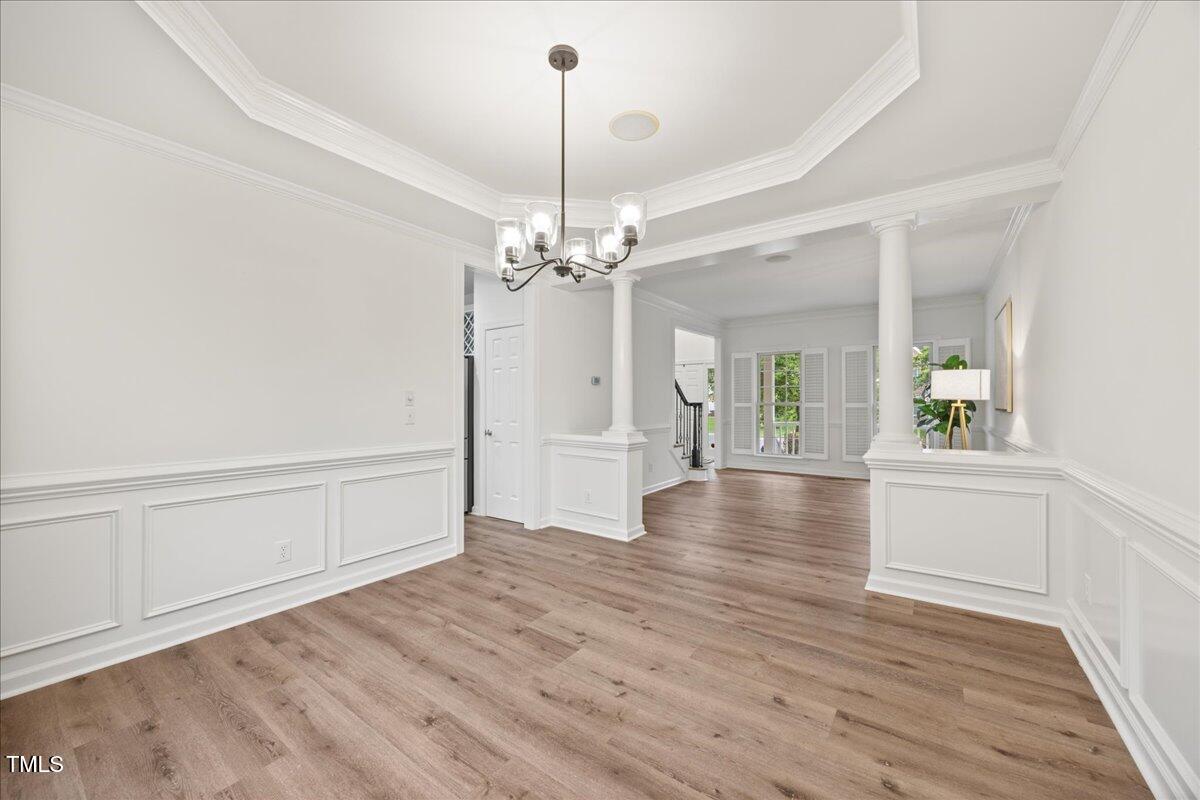 4 Pickard Place Durham, NC 27703 - Photo 25 of 80 a view of a livingroom with wooden floor a ceiling fan and windows