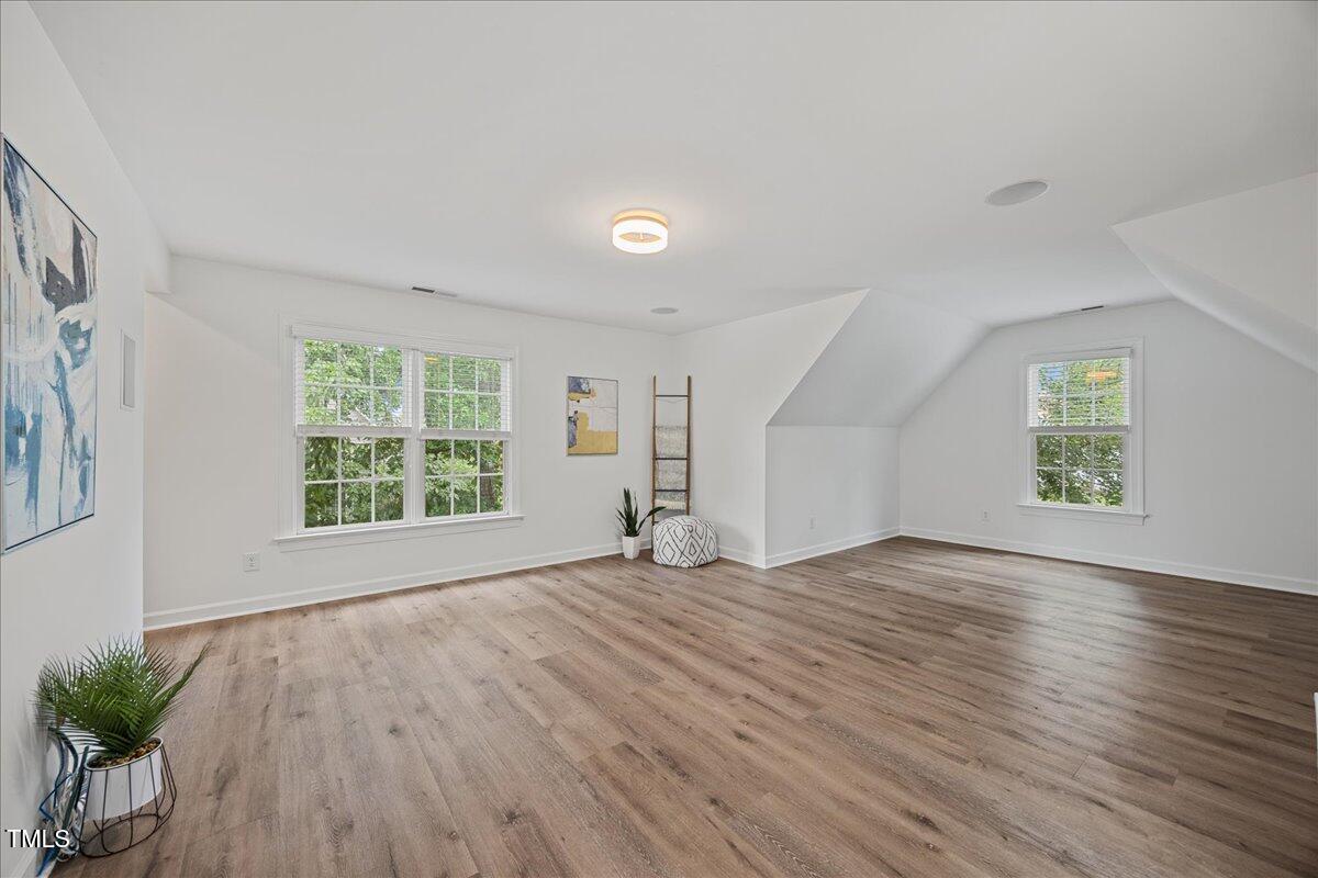 4 Pickard Place Durham, NC 27703 - Photo 28 of 80 an empty room with wooden floor and windows