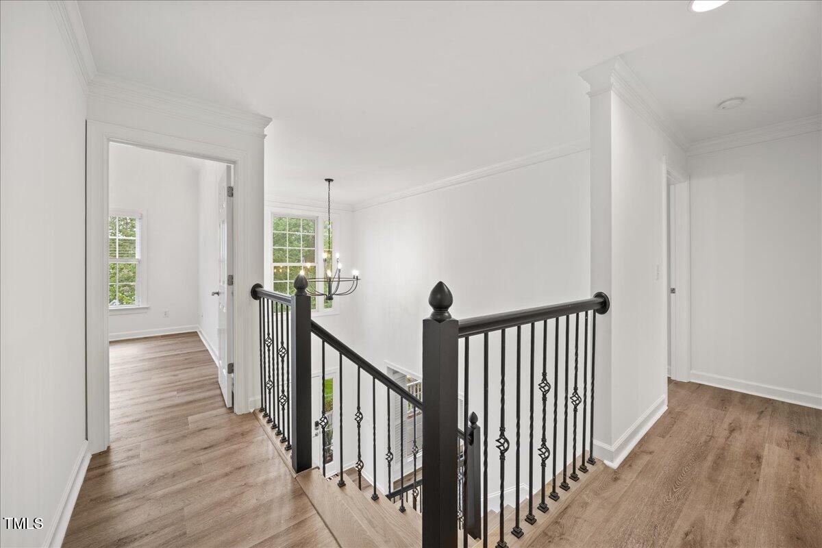 4 Pickard Place Durham, NC 27703 - Photo 33 of 80 a view of a hallway with wooden floor and windows